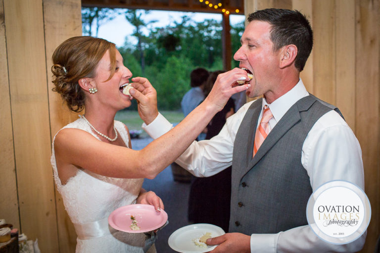 bride-and-groom-feeding-cake-to-each-other-to-smash-or-not-to-smash